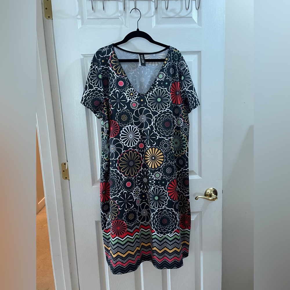 Blue flowered dress bought in Quebec, Canada.  Never worn.